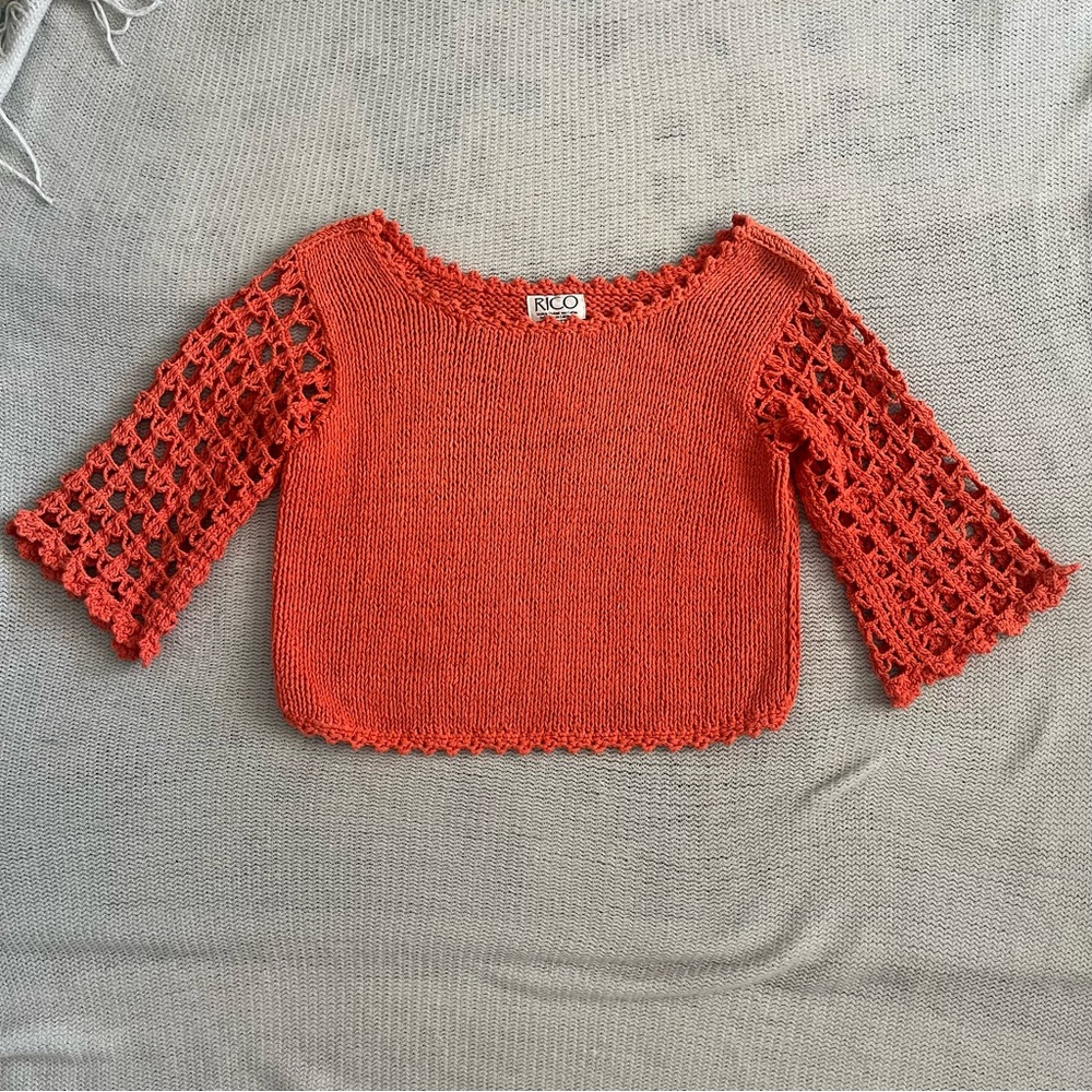 Knit sweater with crochet bell sleeves